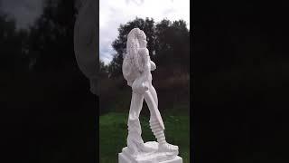 Art beautiful plaster statue in garden