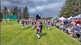 Drum Major leads Strathisla Pipe Band playing Liberton Polka during 2024 Dufftown Highland Games