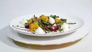 Salad with herring, beetroot, paprika, red onion, mustard and balsamic vinegar. Salad of lettuce