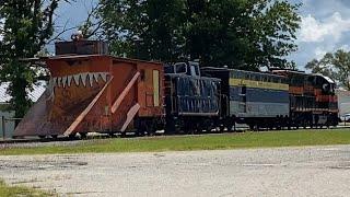 PLNX 57 going by Ashley Michigan with the old TSBY snow plow from Cadillac Michigan 8/11/2024