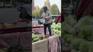 Vendors selling radishes and cabbage on the streets of Xi'an