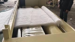 Quilt filling machine with fiber sheets rolling