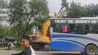 br JCB work cutting tree  with man 