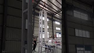 Maxsen gripper conveyor with small bottles testing  vertical transportation solution