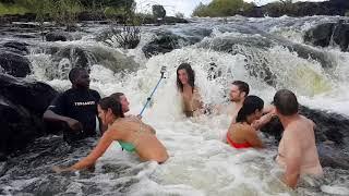 Swimming in the Devils Pool on Livingstone Island by the very edge of the Victoria Falls