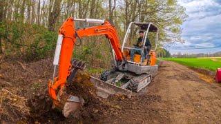 Fixing a broken excavator and dig drainage ditches on dirt road