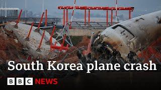 South Korea police raid Muan Airport and Jeju Air offices in plane crash probe | BBC News