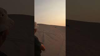 Sand rail wheelies up dune