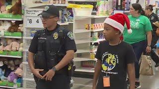 200 students team up with APD officers for annual 'Shop With a Cop'