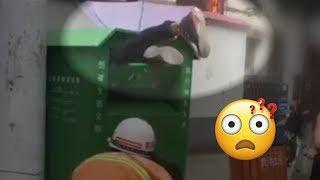 A man gets stuck inside a clothing collection bin