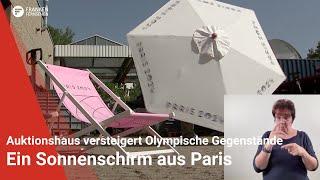 Ein Sonnenschirm aus Paris: Nürnberger Auktionshaus versteigert Gegenstände der Olympischen Spiele