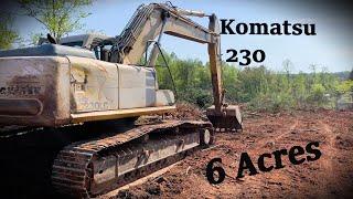 Komatsu 230 Digging Stumps on 6 acres