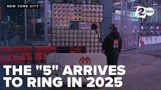 The "5" in the 2025 sign arrives at Times Square to be hoisted into place to countdown the new year