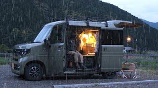 Solo camping in a tiny car in the rain