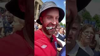 Scotland crowd reacts to an England fan walking in wearing the Three Lions shirt at Euro 2024