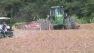 John Deere 4630 with young driver