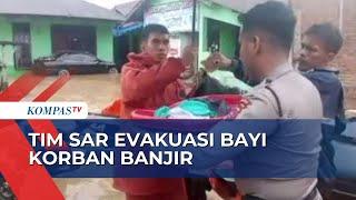 Tim SAR Evakuasi Bayi dan Anak-anak Korban Banjir di Kota Padang