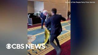 Fistfight erupts when Russian diplomat rips down Ukrainian flag at conference