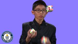 He JUGGLED and SOLVED 3 Rubik's cubes! - Guinness World Records