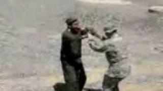 afghan soldier dances with american soldier