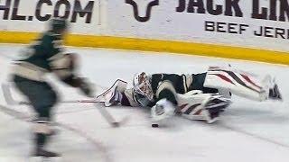 Ilya Bryzgalov falls down playing the puck