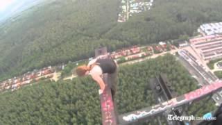 Russian daredevil larks about on top of radio tower in Moscow