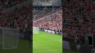 doing the wave at Manchester United game