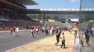 People rushing Mugello Track after Moto GP Race