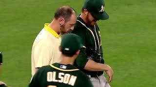 Paul Blackburn takes a comebacker off his wrist