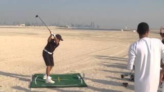 UAE Golf junior hitting some balls on the World Islands in Dubai