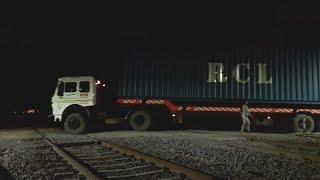 Gateman In Trouble-Loaded Trucks And High Speed Trains Passing At Night