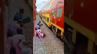 Railway Track Ruckus: Passengers Cross Seconds Before Train's Arrival | #Shorts | #ViralVideo