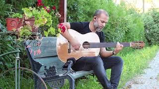 Cenk Erdogan  plays Baritone Fretless Acoustic Guitar