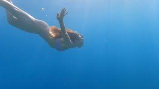 Girl dives without a mask. Mediterranean Sea 