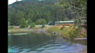 288. OP&E # 19 STEAM TRAIN by lake curve and passenger cars on the OREGON PACIFIC & EASTERN Cottage