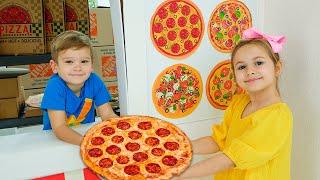 Kinder lernen, Pizza zu kochen und sich gegenseitig zu helfen