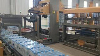 Gantry palletizer for film shrink wrapped bottles