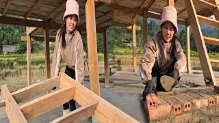 The carpenter girl is building a wooden house, finishing the wooden stairs for the stilt house