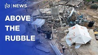 Family in Gaza sets up tent above the rubble of their destroyed home