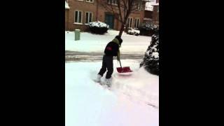 Wee Reporters shoveling snow in Canada