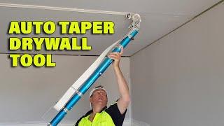 Drywall Taper Working an Auto Taping Tool in A New House Build