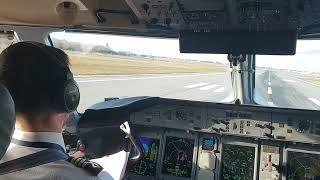 Dash 8 Q400 cockpit landing in Warsaw (WAW), gusty wind