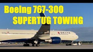 Delta Boeing 767-300ER towed by Supertug