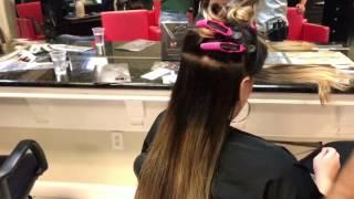 Orlando hair extension educator Nima training at a local salon.