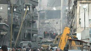 Rescue teams at site where five Israeli missiles struck building in heart of Beirut | AFP