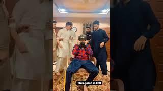 Asim Kamal and freind playing s famous helmet game 