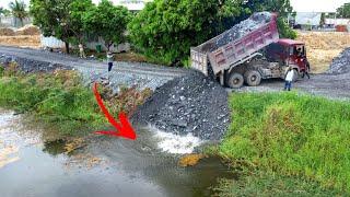 Opening New Project Showing Dump trucks Wheel 10 unloading Stone build New Road push by Dozer