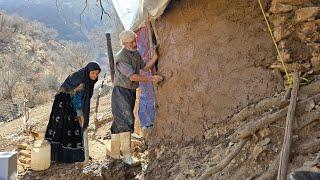 Iran nomadic life: Jahangir finished the front walls of the shelter with mud and straw