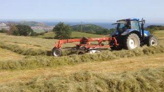 Farmers making hay / straw Hafodty Farm CL caravan site Colwyn Bay Wales Massey Ferguson New Holland