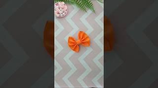 Laranja fita n°9 gorgurão 37cm, pontos de costura 10 para cada lado.Inspiração laço jessica